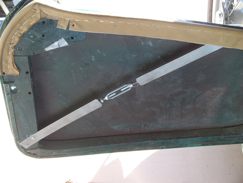 Door reinforcement strap. Adjustable for the perfect fit.